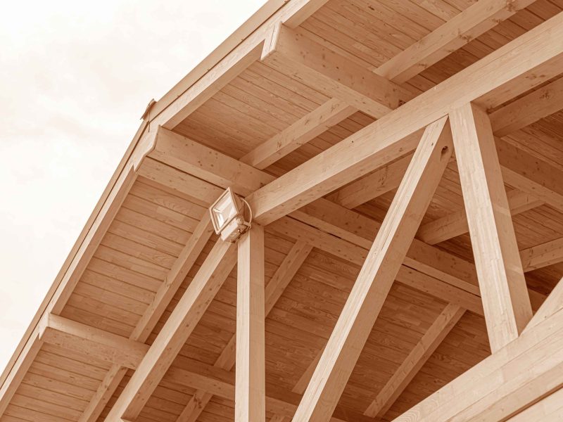 Wooden roof structure. Glued laminated timber roof. Rafters made of wood.